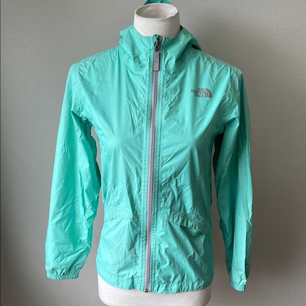 The North Face Teal Raincoat with High Collar and Fitted Silhouette